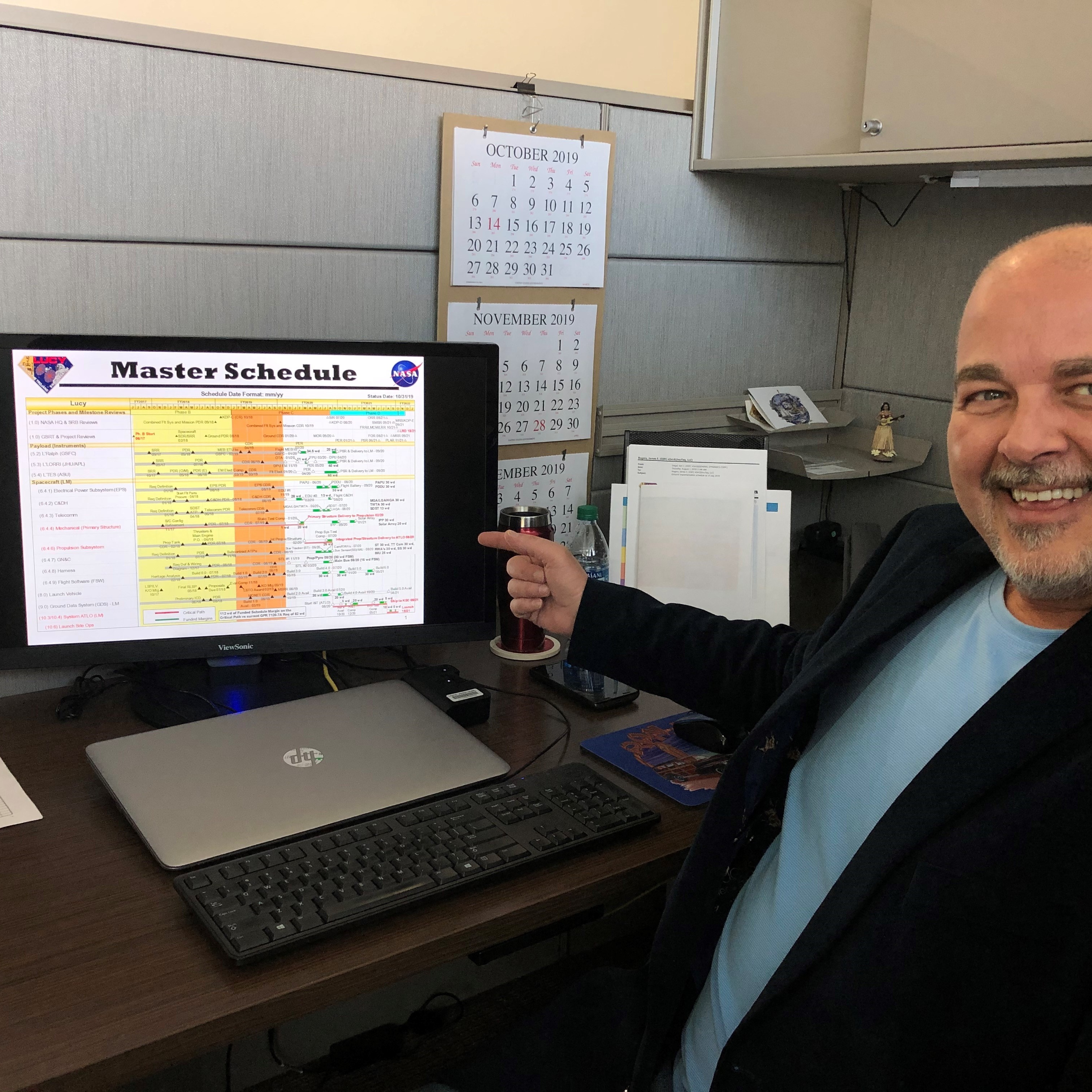 Lucy Scheduler Jim Rogers (GSFC) showing where Lucy is on the master schedule. Schedule is king.